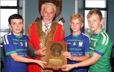  ??  ?? Callum McDonald, football captain; Mayor of Wexford, Jim Moore; Conor Lyne, hurling captain; and Cian Turner, rounders captain.