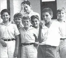  ?? Associated Press ?? SCHOOL DAYS A young Castro, second from right, in 1940 with schoolmate­s in Santiago. He went on to study law at the University of Havana.