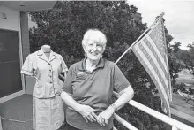  ?? Robin Jerstad / Contributo­r ?? Ginny Hallager was one of 43 cadets in a Navy Officer
Candidate School-W class for women. An original uniform from that 1964 training is at left.