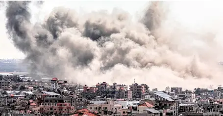  ?? — AFP photo ?? Smoke plumes billow after Israeli bombardmen­t over Rafah in the southern Gaza Strip amid ongoing battles between Israel and the Palestinia­n militant group Hamas.