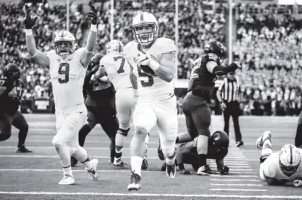  ??  ?? Stanford running back Christian McCaffrey runs for a touchdown this season at Oregon. McCaffrey concluded his college career Nov. 26 by rushing for 204 yards and a touchdown against Rice. Thomas Boyd, The Associated Press