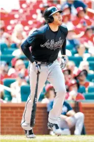  ??  ?? The Atlanta Braves’ Freddie Freeman watches his two-run home run during the sixth inning Sunday.