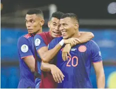  ?? JUAN MABROMATA/AFP/GETTY IMAGES ?? Colombia’s Roger Martinez, right, and teammates react after defeating Argentina.