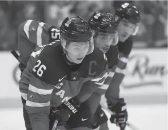  ?? STEVE RUSSELL/TORONTO STAR ?? Curtis Lazar, left, and Darnell Nurse, centre, have gone from last year’s world juniors to playing in the NHL.