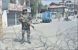  ?? PTI ?? A security personnel stands guard during restrictio­n in Srinagar on Friday following the death of separatist leader Syed Ali Shah Geelani.