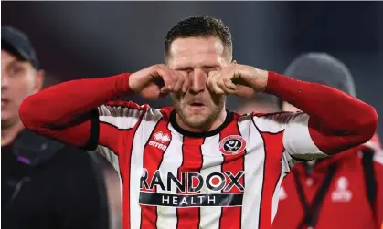  ?? Photograph: Robbie Jay Barratt/AMA/ Getty Images ?? Billy Sharp taunts the Wrexham fans at full time after scoring in Sheffield United’s 3-1 FA Cup win.