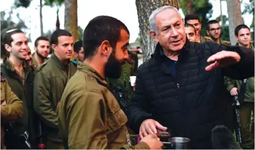  ?? (Kobi Gideon/GPO) ?? PRIME MINISTER Benjamin Netanyahu meets with soldiers in the North yesterday.