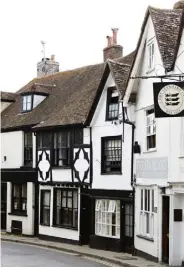  ??  ?? BELOW, FROM LEFT The characterf­ul property is set on a road that runs from the town’s high street down to a riverside quay; original beams divide the