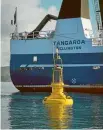  ??  ?? The buoy was lowered into Wellington Harbour on a calm and clear morning.