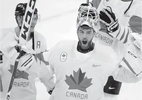  ?? JULIO CORTEZ, AP ?? Canadian goalie Kevin Poulin celebrates after Canada won the men’s bronze medal hockey game against the Czech Republic.