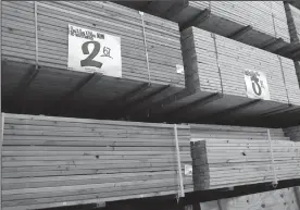  ?? TRIBUNE NEWS SERVICE ?? Boards of lumber lie stacked at Home Depot on North Avenue in Chicago, Ill. The trend of homeowners staying put in their starter homes has changed the housing market.