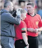  ??  ?? INJURED Rangers fan threw a coin at a linesman at a match against Livingston