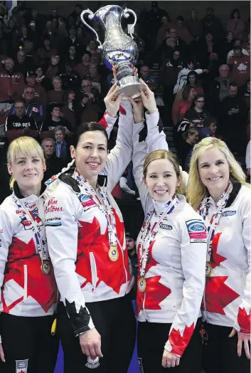  ?? PAUL CHIASSON/THE CANADIAN PRESS FILES ?? Lead Dawn McEwen, second Jill Officer, third Kaitlyn Lawes and skip Jennifer Jones, left to right, hoist the trophy after Canada’s eleventh-end win over Sweden at the World Women’s Curling Championsh­ip in North Bay, Ont., on Sunday. The title was...