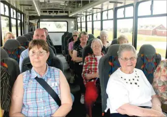  ?? LYNN KUTTER ENTERPRISE-LEADER ?? Hannah Burgess, left, of Lincoln and Margie Galloway of Prairie Grove ride Ozark Regional Transit’s new Route 620 along with other seniors from Prairie Grove and Lincoln. The group was trying out Route 620, a new fixed route that goes from West Fork to...