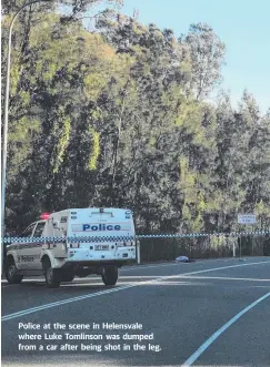  ??  ?? Police at the scene in Helensvale where Luke Tomlinson was dumped from a car after being shot in the leg.