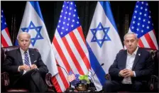  ?? MIRIAM ALSTER — POOL/AFP VIA GETTY IMAGES ?? President Joe Biden sits with Israeli Prime Minister Benjamin Netanyahu at the start of the Israeli war cabinet meeting, in Tel Aviv on Oct. 18, amid the ongoing battles between Israel and the Palestinia­n group Hamas.