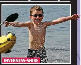  ??  ?? Splashing time: Dylan Farrell enjoys Loch Morlich