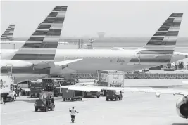  ?? ?? American Airlines jets at Dallas-Fort Worth Internatio­nal Airport.