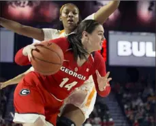  ?? Associated Press ?? Georgia center Jenna Staiti drives to the basket in a 66-62 upset of No. 13 Tennessee Sunday in Athens, Ga.