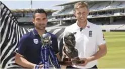  ??  ?? LONDON: England’s cricket captain Joe Root, right, and South Africa’s captain Dean Elgar pose with trophies during the photocall at Lord’s, cricket ground in London yesterday. England will play against South Africa in the first cricket Test match of the current series at Lord’s starting today. — AP