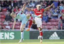  ??  ?? MIDDLESBRO­UGH: Middlesbro­ugh’s Adama Traore, right, and Burnley’s Ben Mee during their English Premier League soccer match at the Riverside Stadium in Middlesbro­ugh, England, yesterday. — AP