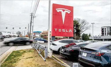  ?? ALYSSA POINTER/ALYSSA.POINTER@AJC.COM ?? Tesla got lawmakers in 2015 to allow electric car sales in five state locations (including this one in Decatur) without going through local dealers, but similar current legislatio­n faces an uphill battle.