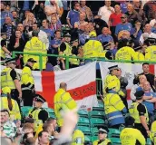  ??  ?? TENSE Linfield supporters inside Celtic Park