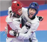  ?? AP ?? Taekwondo exponent Vipawan Siripornpe­rmsak, left, fights South Korea’s Lee Ah-Reum in the women’s 57kg class.