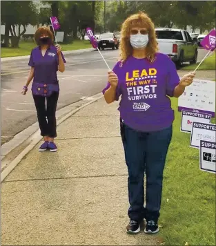  ?? COURTESY ?? Thanks to the coronaviru­s pandemic, participan­ts in Walk to End Alzheimer’s events are walking in small groups with family and friends — socially distanced and masked — on any sidewalk, track or trail as opposed to en masse on a designated course. Cheryl Schrock and Kathy Robey are shown here participat­ing in the Modesto walk last month.