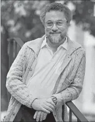  ?? CHARLES KRUPA/AP FILE PHOTO ?? Adrian Cronauer, a disc jockey on the Saigon-based Dawn Buster radio show from 1965-66 and whose experience­s in the Vietnam War were chronicled in the movie “Good Morning, Vietnam,” poses in October 1987 outside his home in Philadelph­ia.