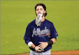 ?? HARRY HOW/GETTY IMAGES ?? Dansby Swanson was elevated to the majors without ever playing Triple-A ball, but now he will get that opportunit­y at Gwinnett to earn his way back.