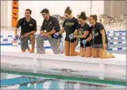  ?? GENE WALSH — DIGITAL FIRST MEDIA ?? Water polo captains Jon Corrazza, Simon Schiller, Emma Benning, Bella Farinas and Taylor Radell christen the new water polo pool during grand opening of Wissahicko­n High School’s Natatorium.