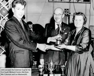  ??  ?? John accepts the Coleman Cup for his first South Midland Centre title from Mrs Coleman and Les Wadsworth.