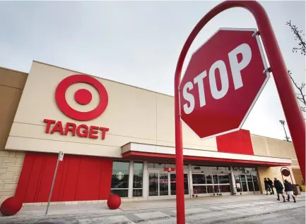  ?? (Peter Power/Reuters) ?? CUSTOMERS ENTER a Target store. The company’s chief executive, Brian Cornell, told members of the House Ways and Means Committee that an import tax could impact consumers’ ability to buy essential goods, such as baby supplies that are made overseas and...