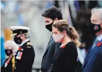  ?? SEAN KILPATRICK, THE CANADIAN PRESS ?? Prime Minister Justin Trudeau and wife Sophie Grégoire Trudeau take part in the Remembranc­e Day ceremony at the National War Memorial in Ottawa on Wednesday.