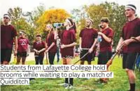  ??  ?? Students from Lafayette College hold brooms while waiting to play a match of Quidditch.