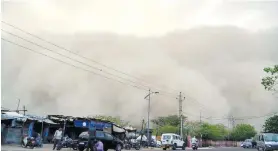  ??  ?? Dust storm in India.