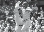  ?? NAM Y. HUH AP ?? Manny Machado (right) celebrates with Matt Carpenter after hitting a solo homer in second inning.