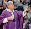  ?? MIKE DE SISTI / MILWAUKEE JOURNAL SENTINEL ?? Milwaukee Archbishop Jerome Listecki delivers his homily during Ash Wednesday Mass at Pius XI Catholic High School in 2016.