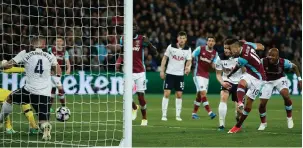  ??  ?? Manuel Lanzini scores the winning goal for West Ham which dented Tottenham Premier League title hopes