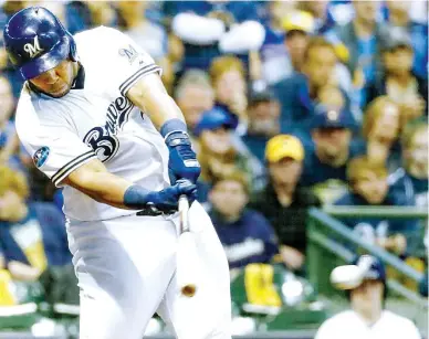  ??  ?? Milwaukee Brewers' Jesus Aguilar hits an RBI single during the eighth inning of Game 6 of the National League Championsh­ip Series baseball game against the Los Angeles Dodgers in Milwaukee. (AP)