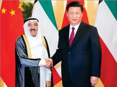  ?? LI XUEREN / XINHUA ?? President Xi Jinping greets Kuwaiti Emir Sheikh Sabah Al-Ahmad Al-Jaber Al-Sabah at the Great Hall of the People in Beijing on Monday. The two countries agreed to establish a strategic partnershi­p.