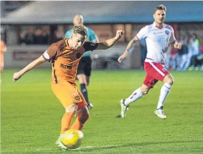  ?? Picture: SNS. ?? Billy King fires home United’s second in Tuesday’s 5-0 win over Brechin at Glebe Park.