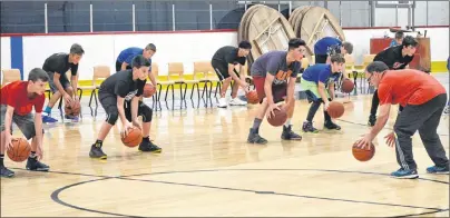  ?? CHRISTIANR­OACH/CAPE BRETON POST ?? Bill Kachafanas, coach of the bantam boys team for Basketball Cape Breton, runs drills with players hoping to make the team at the Centennial Arena in Sydney on Wednesday. The organizati­on has booked open gym time this week to get the word out about the upcoming season and next week’s tryouts.