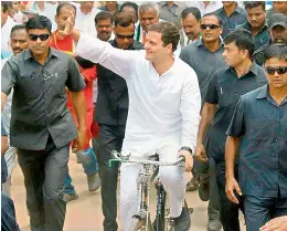  ?? PTI ?? Congress President Rahul Gandhi rides a bicycle to protest against the fuel price hike at Malur in Kolar district on Monday. —