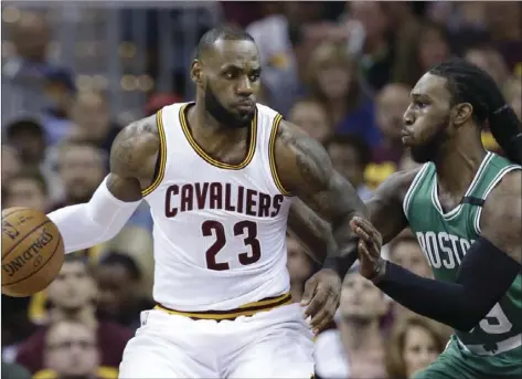  ?? AP PHOTO ?? Cleveland Cavaliers' LeBron James (left) looks to drive against Boston Celtics' Jae Crowder during the first half of Game 3 of the NBA basketball Eastern Conference finals Sunday in Cleveland.