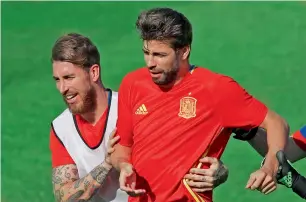  ?? AP ?? Sergio Ramos and Gerard Pique during a training session. —
