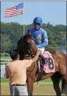  ?? DAVID M. JOHNSON — DJOHNSON@ DIGITALFIR­STMEDIA. COM ?? Uncle Sigh, with Jose Ortiz up, won Race 7 on Monday at Saratoga Race Course. It was the fourth of five winning rides for Ortiz on the day.