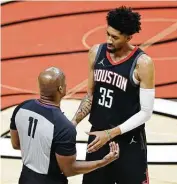  ?? Michael Reaves / Getty Images ?? Christian Wood, who had 18 points and seven boards, argues a foul call with referee Derrick Collins.