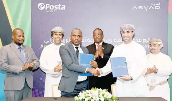  ?? ?? Nasser al Sharji, CEO of Oman Post and Asyad Express, and Macrice Daniel Mbodo, Postmaster General of TPC, after signing the MOU in Muscat on Thursday.